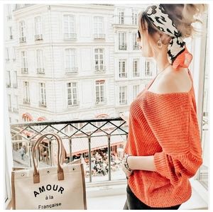 Slightly shiny, loose red spring sweater